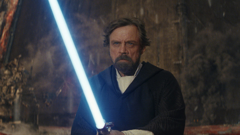 Luke Skywalker ignites his lightsaber