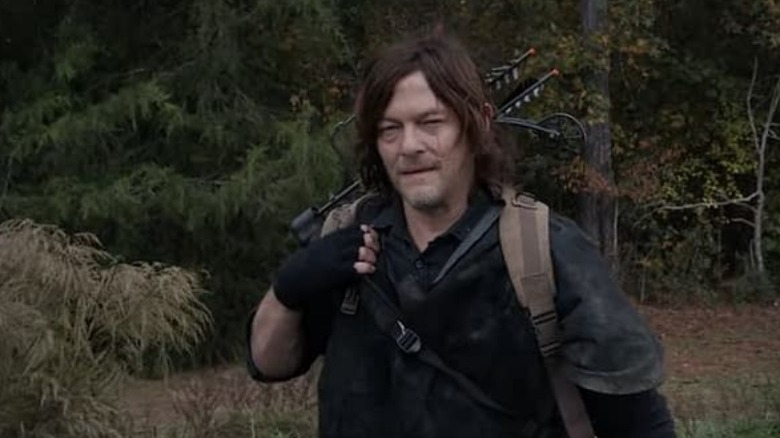 Daryl walking in the woods The Walking Dead