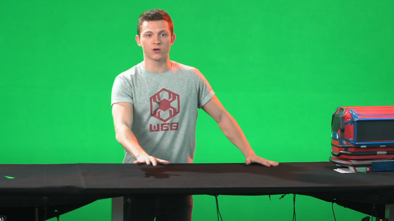 Peter hosts a class in front of a green screen