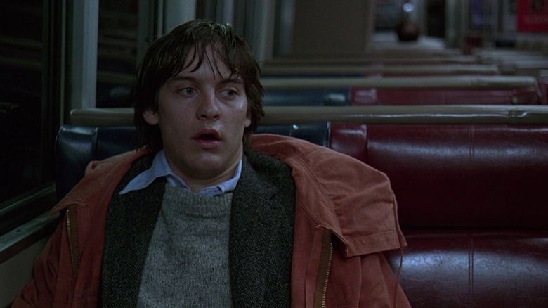 Tobey Maguire sits on a bus