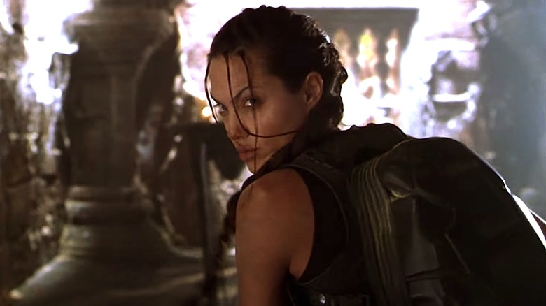 Lara Croft fighting bad guys