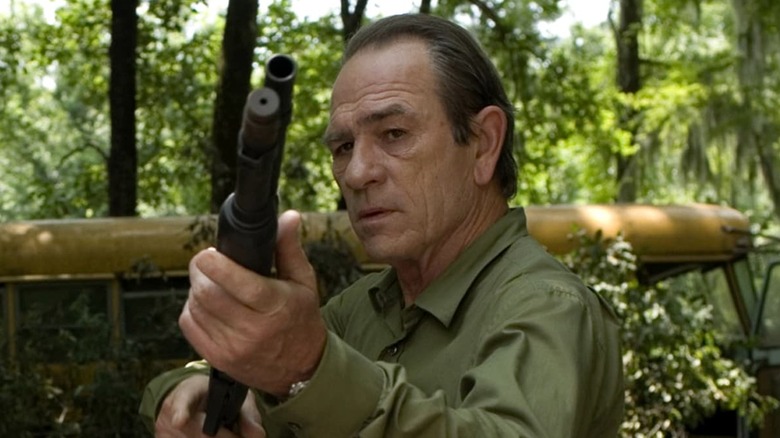 Dave Robicheaux wields his gun in "In the Electric Mist" (2009)