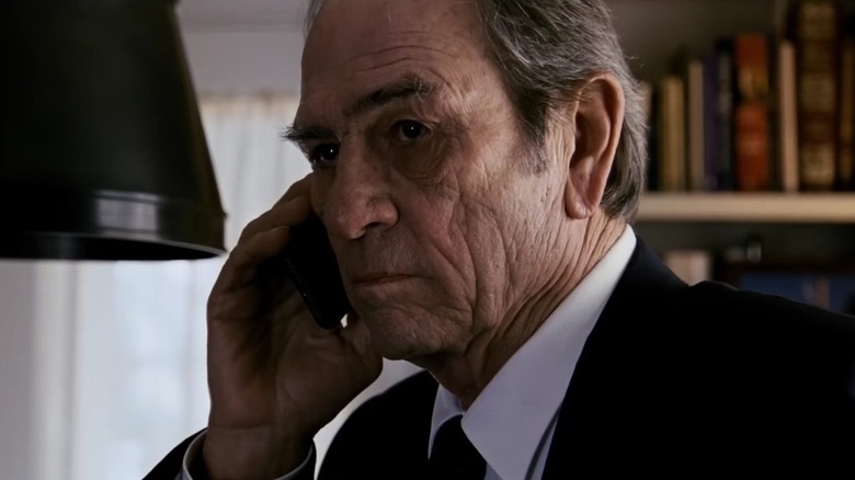 CIA director Dewey makes a call in "Jason Bourne" (2016)