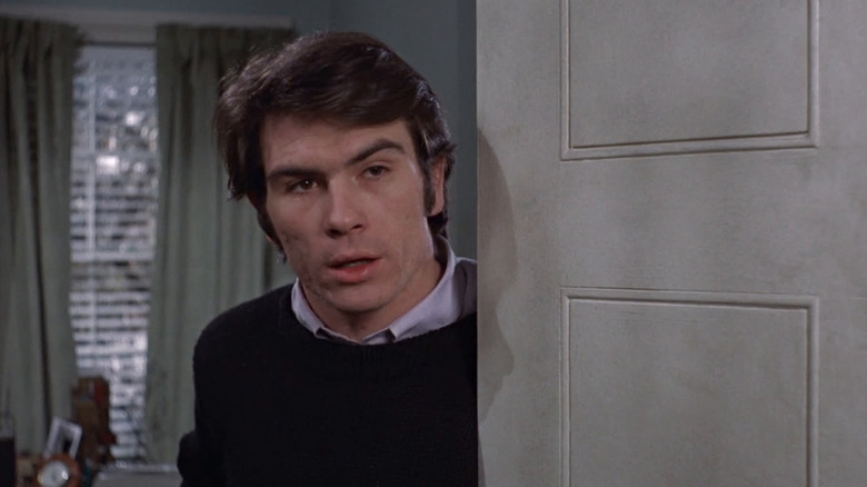 Hank answers the door in "Love Story" (1970)