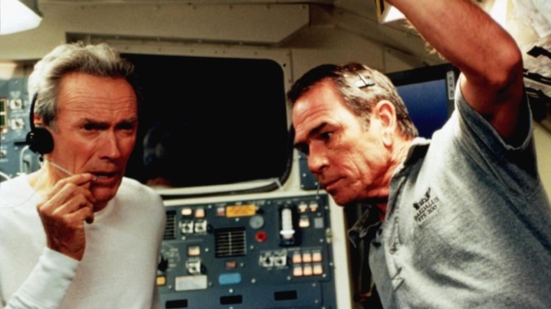 Frank and Hawk listen to a message in "Space Cowboys" (2000)