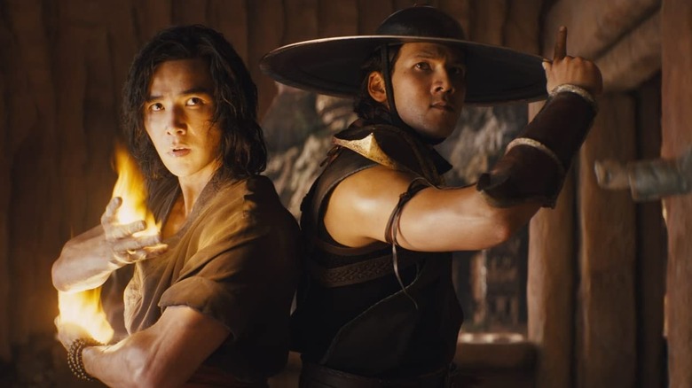 Lui Kang and Kung Lao standing back to back as they prepare to fight