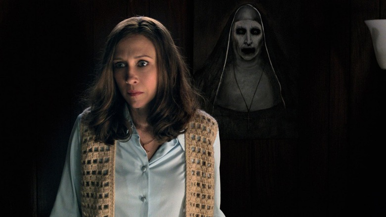 Lorraine Warren looking horrified in front of the nun painting in The Conjuring 2