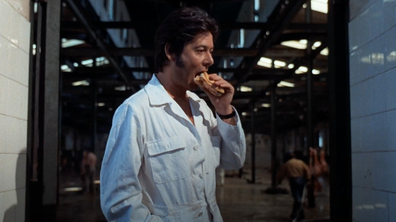 Factory worker eating sandwich