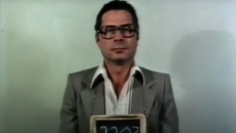 Man with glasses mugshot