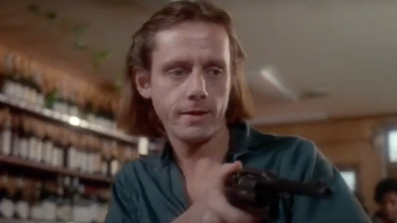 William Sanderson with gun