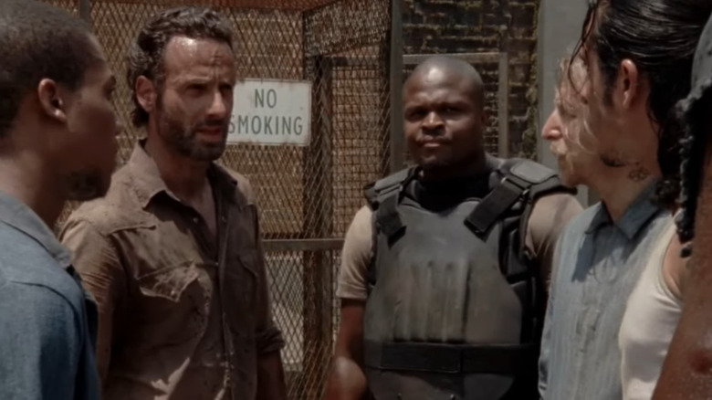 Rick and T-Dog talking to prisoners