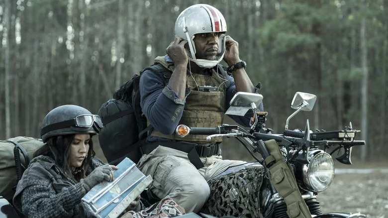 Joe and Evie in a sidecar motorcycle