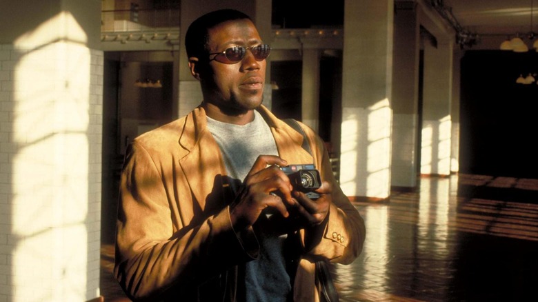 Wesley Snipes holds a camera