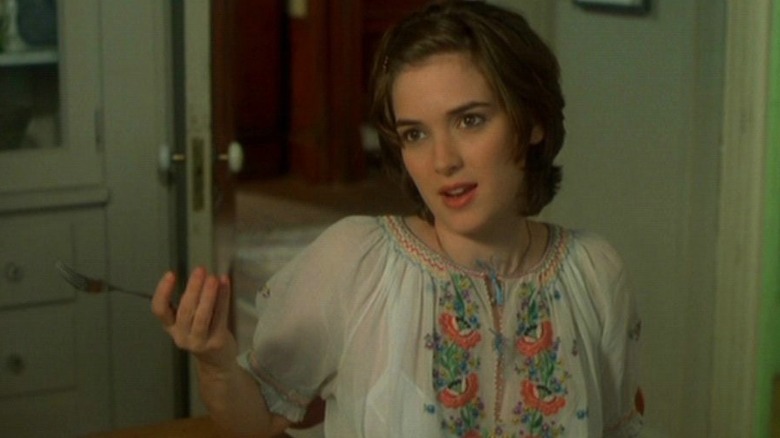 Winona Ryder holds a fork