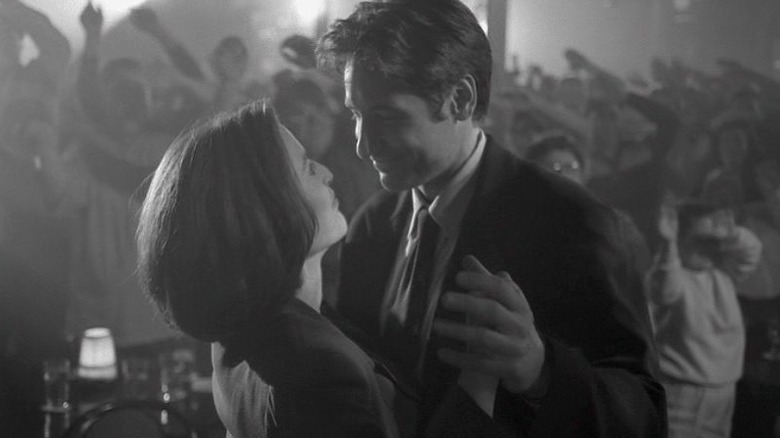 Scully and Mulder dancing in black and white