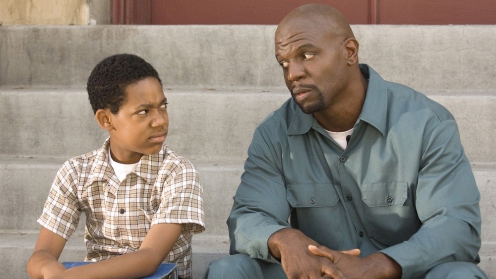 Young Chris and Julius sitting on stairs