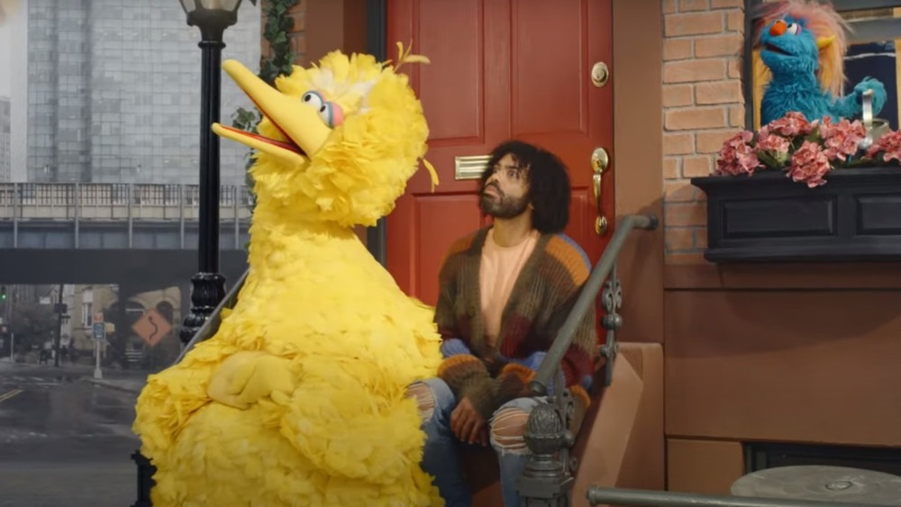 Big Bird and Daveed Diggs staring