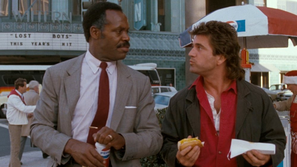 Danny Glover and Mel Gibson talking