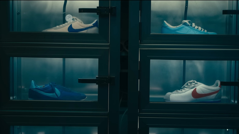 A wall of Nike shoes on display 