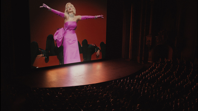 Marilyn Monroe projected in a crowded theater