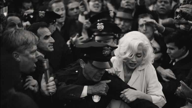 Marilyn Monroe with a police escort