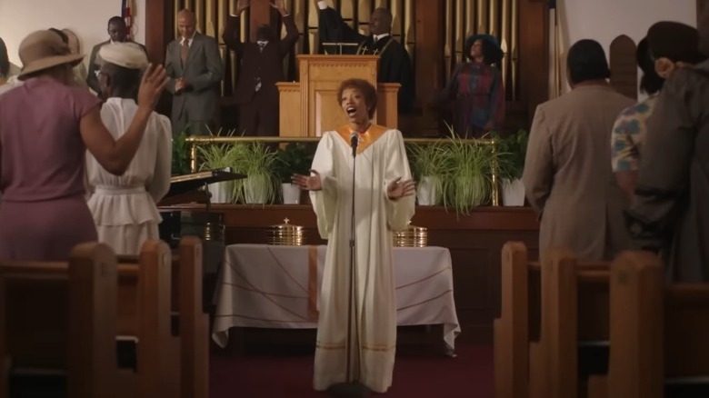 Whitney Houston performing in front of congregation