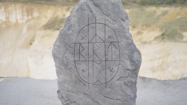 Carved Norse runes on rock