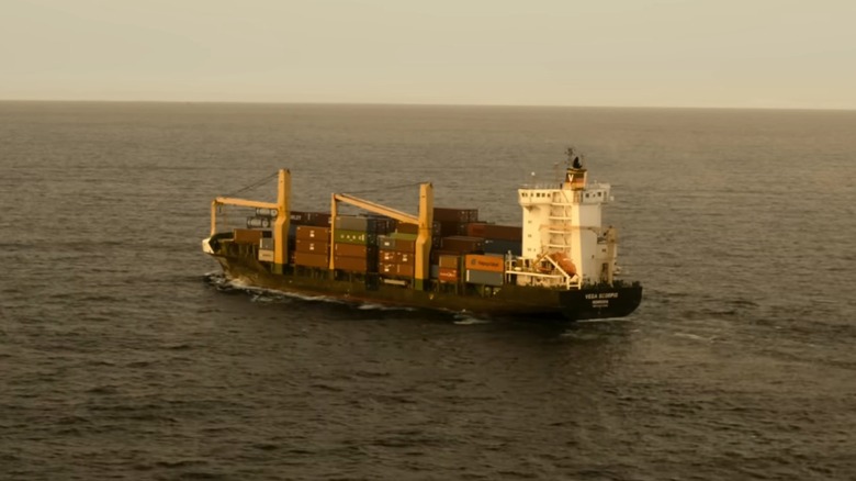 Cargo ship moving through ocean