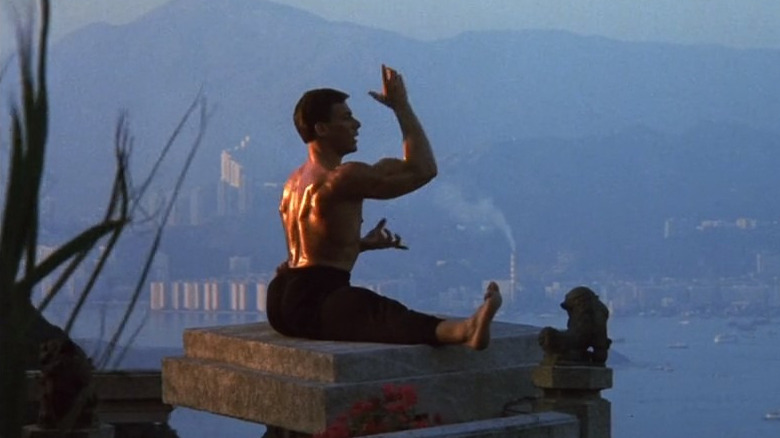 Frank Dux doing splits on a balcony