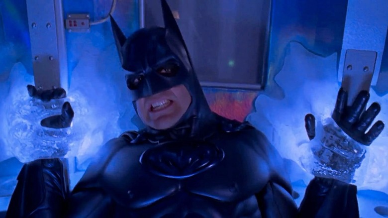 Batman with hands frozen to wall