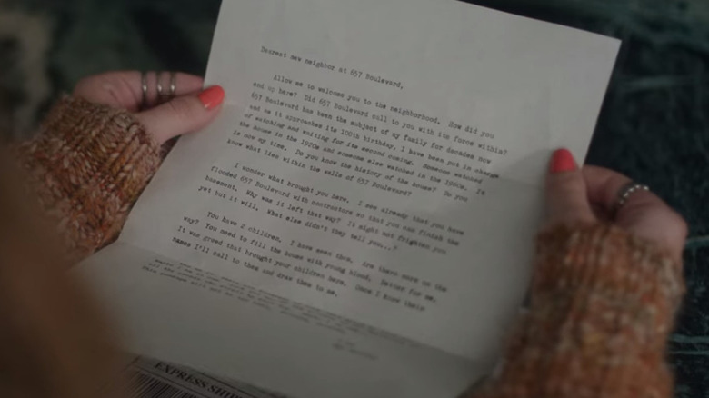 Ellie holding the first Watcher letter