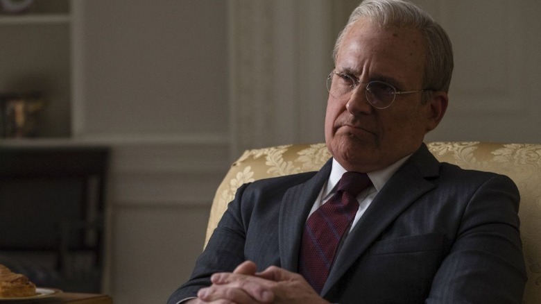 Steve Carell as Donald Rumsfeld folding hands on lap