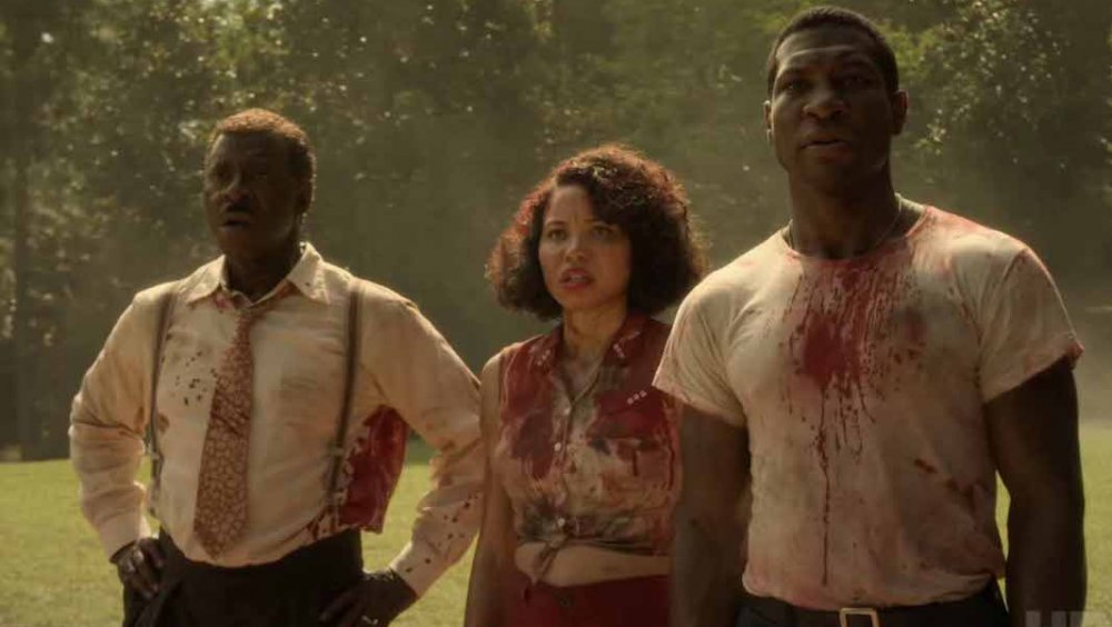 Jurnee Smollett-Bell as Letitia "Leti" Dandridge, Jonathan Majors as Atticus Black, and Courtney B. Vance as George Black in Lovecraft Country