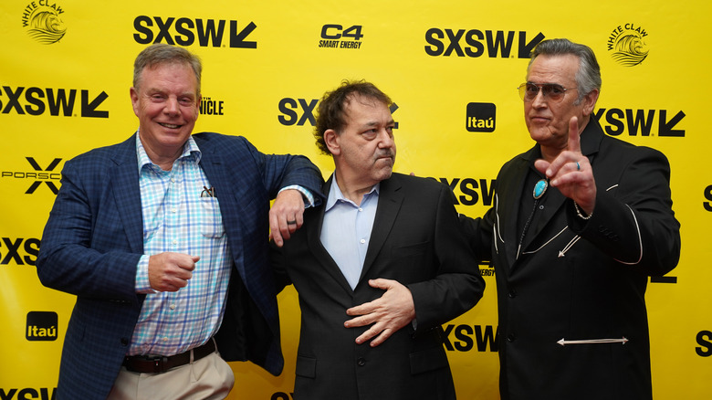 Rob Tapert, Sam Raimi, and Bruce Campbell posing