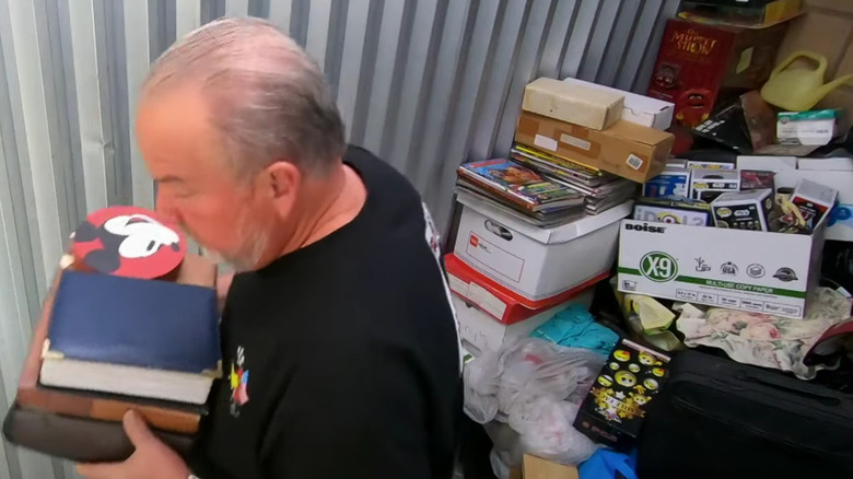 Darrell Sheets sorting through storage locker