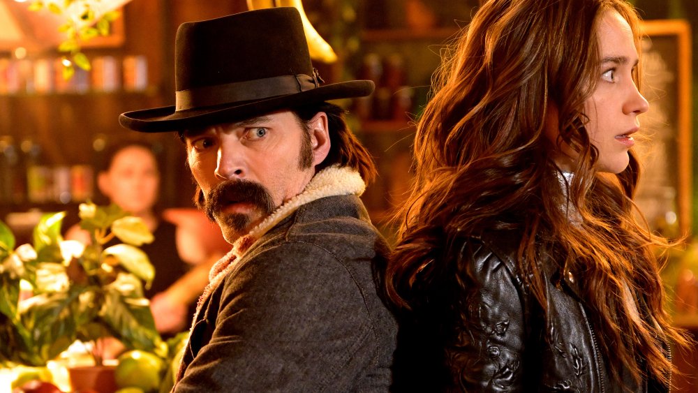 Tim Rozon as Doc Holliday, Melanie Scrofano as Wynonna Earp