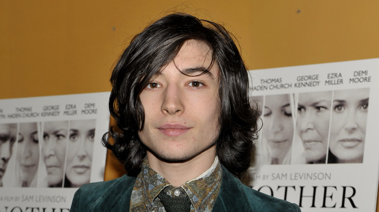 Ezra Miller posing at premiere 