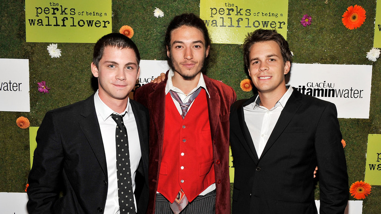 Ezra Miller poses with co-stars