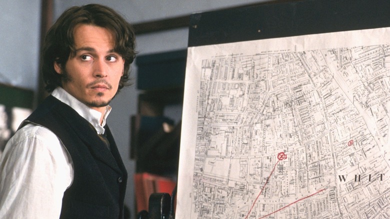 Johnny Depp looking at an old map 