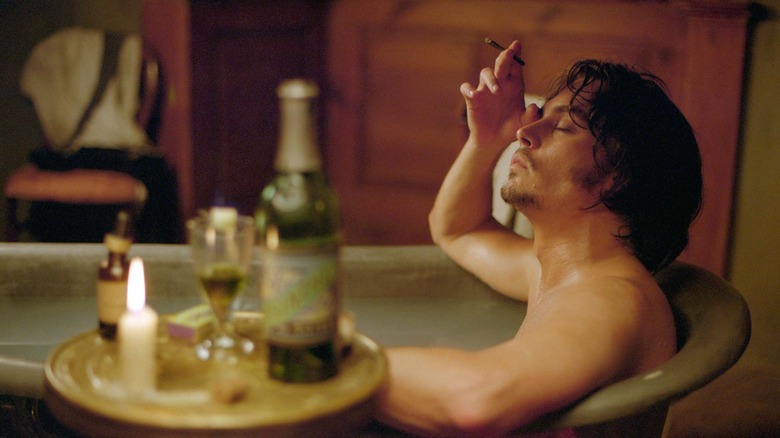 Johnny Depp smoking in a bath 