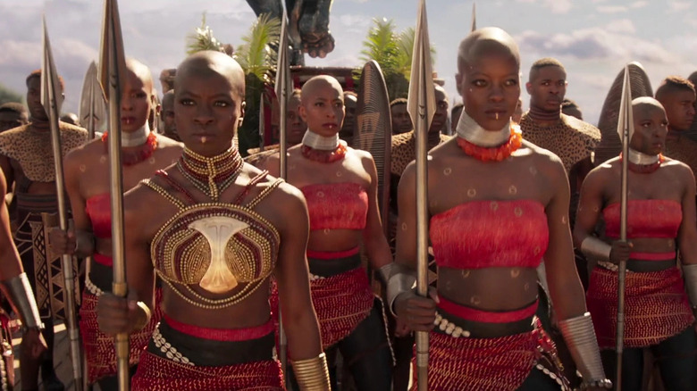 Ayo and Okoye stand with Dora Milaje