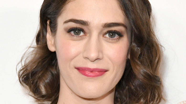 Lizzy Caplan smiling