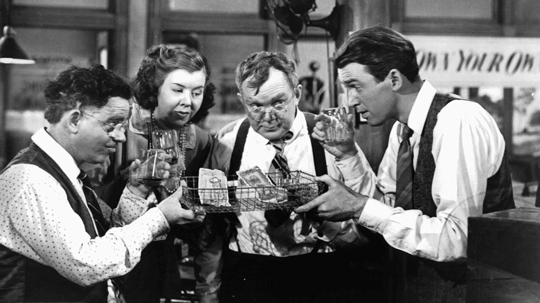 George Bailey and the billing and loan employees with money