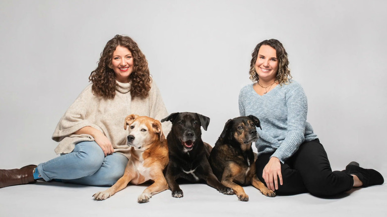 Kelly and Ilana sitting with their dogs