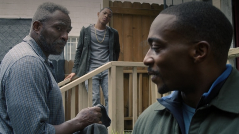 Sam Wilson, Isaiah Bradley, and Eli Bradley talking outside