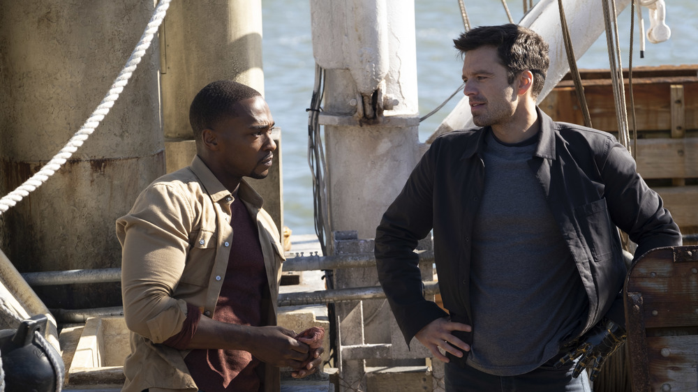 Sam and Bucky hang out on a dock