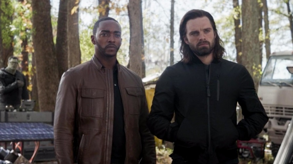 Sam and Bucky stand in the trees