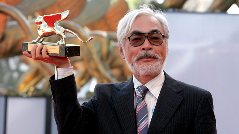 Miyazaki holding award