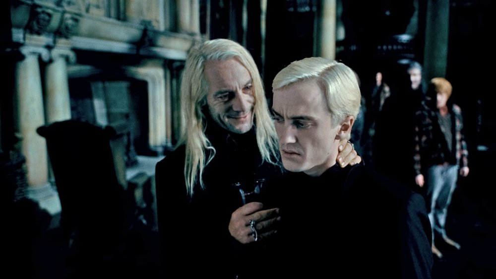 Jason Isaacs as Lucius Malfoy and Tom Felton As Draco Malfoy in Harry Potter and the Deathly Hallows Part 1