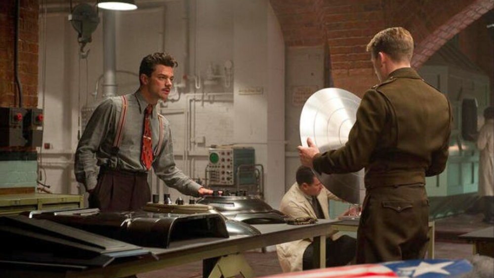 Dominic Cooper as Howard Stark showing Steve Rogers his shield in Captain America: The First Avenger